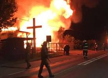 Two evangelical churches burned and firefighters shot at in Chile