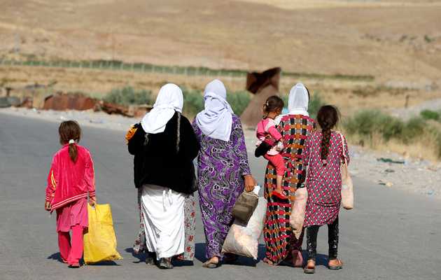 Women and children from the minority Yazidi sect, fleeing the violence in the Iraqi town of Sinjar, August 14, 2014.,yazidi women children