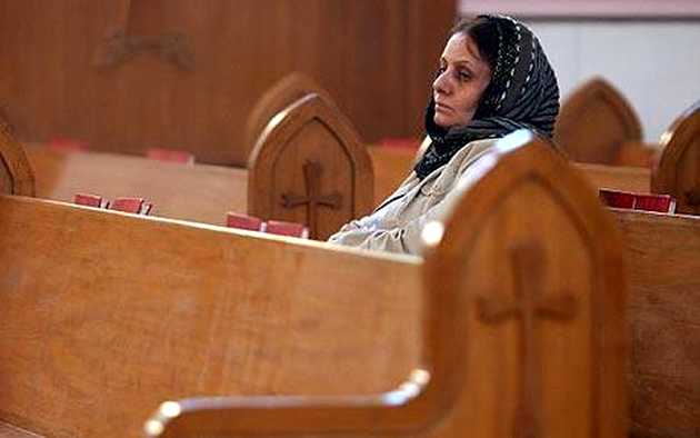 An Iraqi Armenian Christian woman attending church in Baghdad / The Telegraph,Iraq, Armenian Christian