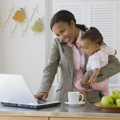 Women with children can expect to earn less when they return to work / Corbis