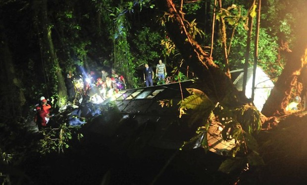 The bus, carrying about 60 people, fell 400 meters into a wooded area. / Salmo Duarte/AFP/Getty Images,
