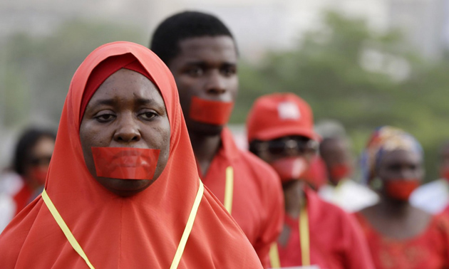 Peopla marching on Monday during a silent protest. / AP,Bring back our girls one year