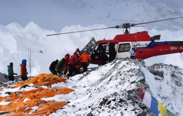 Injured hikers in Everest base camp being rescued.