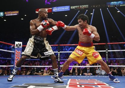 Mayweather and Pacquiao during the fight / Getty images