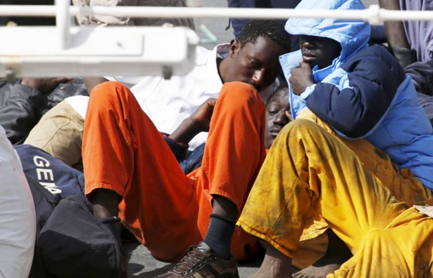 Migrants lie on the deck of the Italian coastguard ship Bruno Gregoretti in Senglea, Malta. / Reuters,mediterraean