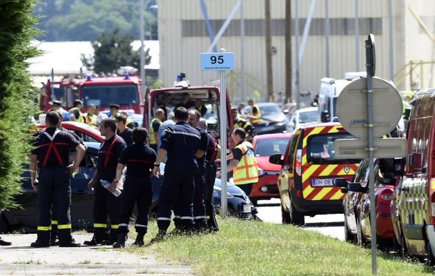 Police and firemen near the factory attacked  / Getty images,