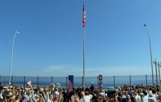 People cheering after the US flag was raised / EPA,