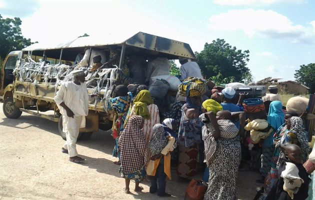 Some of the rescued women and children are taken to safety,