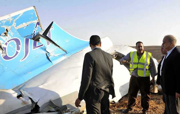 Egypt’s prime minister, Sherif Ismail, right, examines wreckage from the aircraft in the Sinai peninsula. Photograph: Suliman el-Oteify / AP,Russian, plane crash