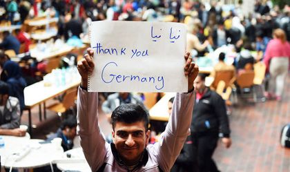 A refugee thanks Germany for its hopitality. / Agencies
