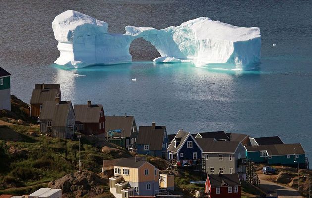  Iceberg drifting off the village of Kulusuk in Greenland. / Reuters,iceberg