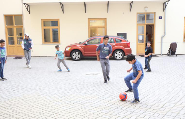 Children playing outside the CDM building. / CDM Teen Challenge Czech Republic,cdm teen challenge, Czech Republic, Prague