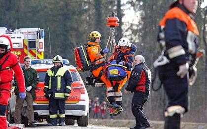 Rescue teams work at the site of a train accident / AP