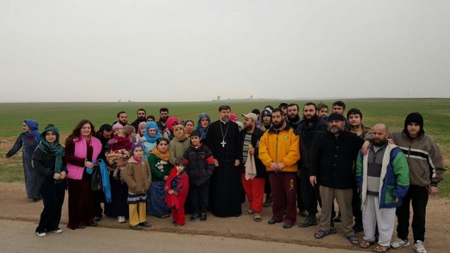 The group of 43 freed Assyrian Christians. / Acero,assyrian christians, freed, 43, syria