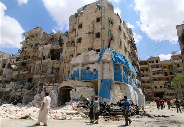 People inspect the damage at Al Quds hospital in Aleppo. / Reuters,aleppo, hospital, strikes