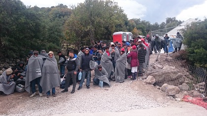 Refugees in Lesvos, waiting to be brought to a new camp. / Give A Hand