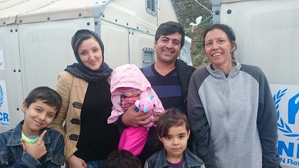 A family of refugees and a volunteer. / Give A Hand.