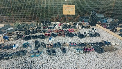 Every pair of shoes = 1 person. / Give A Hand