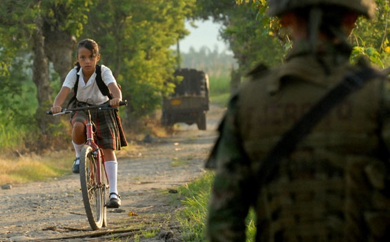 A student goes through a military control in Colombia. / Agencies