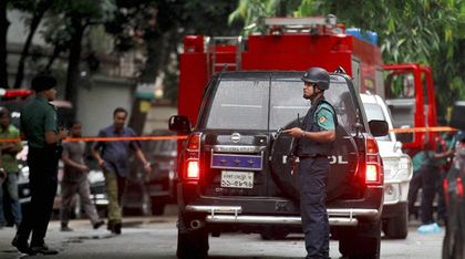 Bangladeshi commandos stay at the crime scene after the siege.