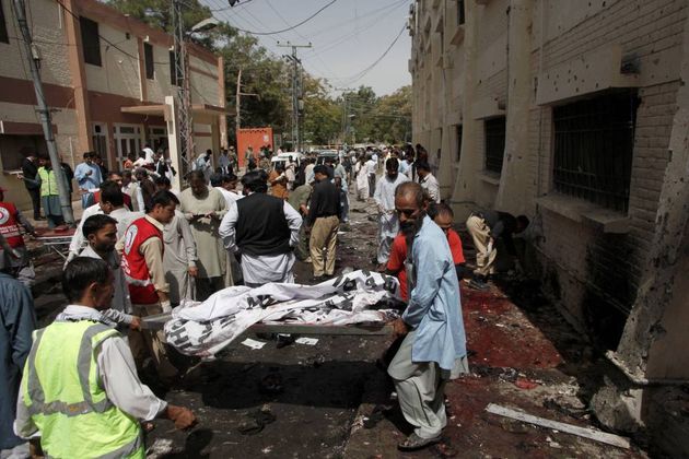 Hospital employees and volunteers at the attack scene/ Reuters,