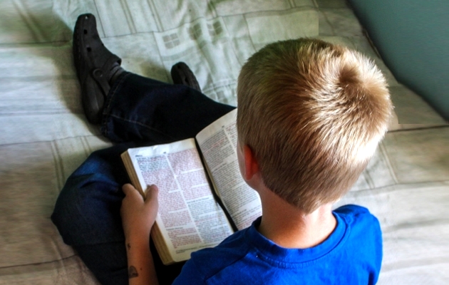 A teenager reeding the Bible,teenager, Bible