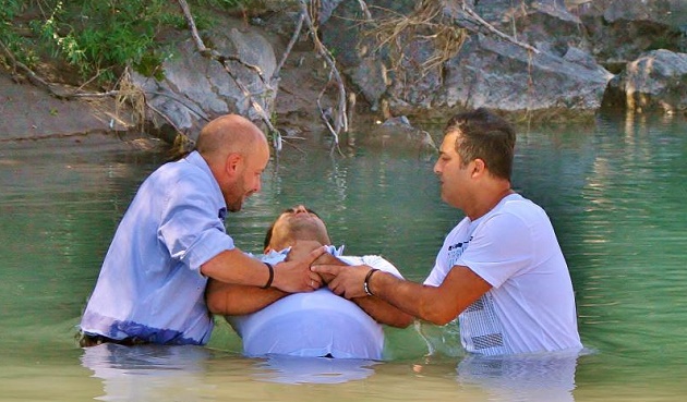 An asylum seeker gets baptised with a Pentecostal church in Weishaus (Germany). / All-in.de,baptism, germany, pentecostal, evangelical