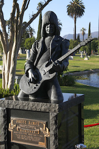 Johnny Ramone's effigy plays his guitar in a cemetery in Hollywood.