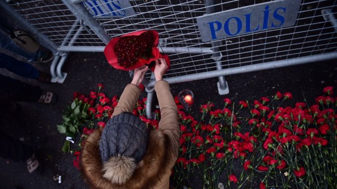 Flowers are laid outside the nightclub, a glitzy venue in the cosmopolitan Ortakoy district. / AFP,