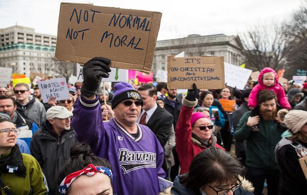 Demonstrators gather near the White House to protest President Donald Trump’s travel ban on seven Muslim countries on Sunday in Washington. / Getty,