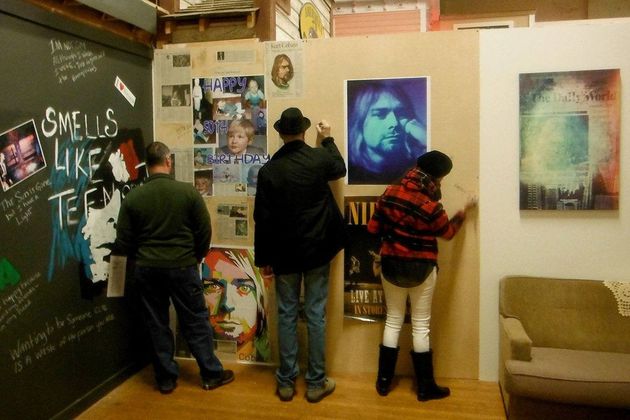 Visitors to the Aberdeen Museum of History write a personal greeting for what would have been Cobain’s 50th birthday. ,