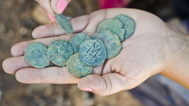 The coins bear the images of three important Byzantine emperors. / Israel Antiquities Authority.,