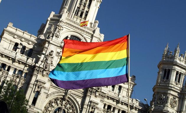 A rainbow flag in front of the Madrid City Hall.,