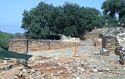 A slope with the remains of stone walls at Tel Dan, the place where Lawrence Mykytiuk found a reference to King David.