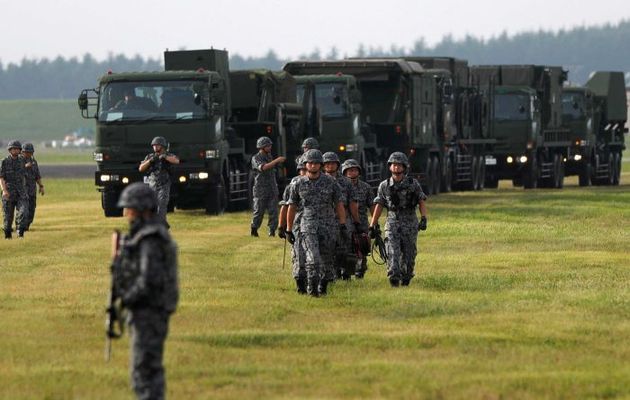 Japanese soldiers take part in a drill in response to a recent missile launch by North Korea. / Reuters,