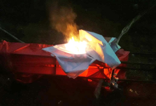 Hindu extremists burned a banner from the planned gospel campaign in Charoda, Chhattisgarh state, India. / Morning Star News,