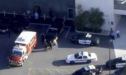 Police and paramedics at the cime scene. / CNN Live