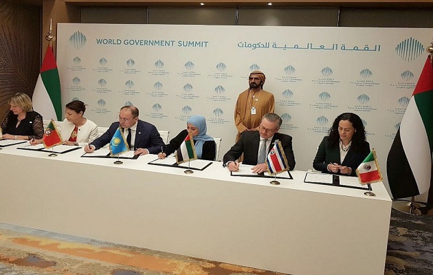 The representatives of the member countries signing the agreement . / The United Arab Emirates Press.,