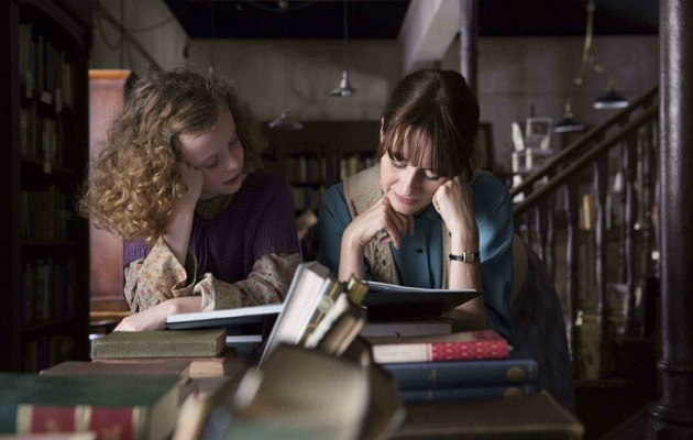 Florence reads with one of the girls in the town, in The Bookshop. ,