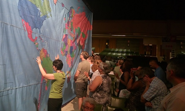 The massive world map encouraged people to pray for the world. / OM,