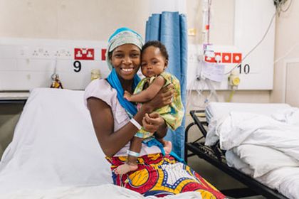 Aissata and her mother, after the surgery on the Africa Mercy. / Mercy Ships