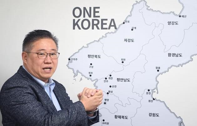 Christian worker Kenneth Bae, with a map showing an unified Korea. / Facebook Kenneth Bae,