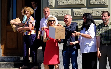 Promoters brought the 130,000 signatures to the Swiss Parliament. / Facebook AGWB