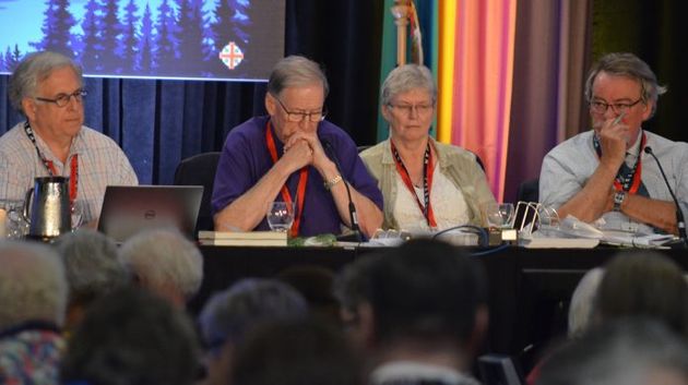 Primate Fred Hiltz and officers of General Synod during the voting. / Anglican Church of Canada.,