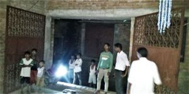 Young people at entrance of house where film was shown in Jamalpur, Bihar state, India. / Morning Star News.,