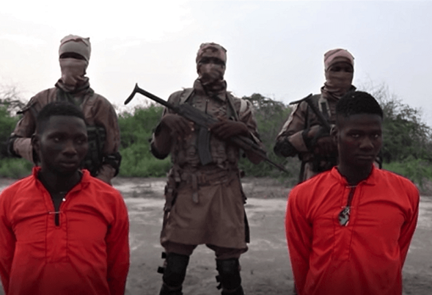 Screen capture from Islamic State’s Amaq news site of Christian aid workers Godfrey Ali Shikagham (left) and Lawrence Duna Dacighir before their execution by Boko Haram. / Morning Star News,