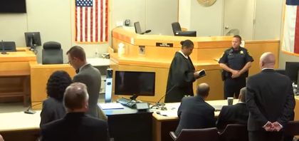 Judge Tammy Kemp gives Amber Guyger her personal Bible.  / You Tube capture.