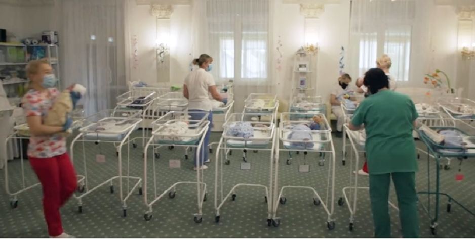Babies of surrogate mothers stranded in a hotel in Kyiv, Ukraine. / Image captured from a <a target="_blank" href="https://www.bbc.com/news/av/world-europe-52673225/coronavirus-surrogate-babies-stranded-in-ukraine">BBC video report</a> published on 15 May 2020,