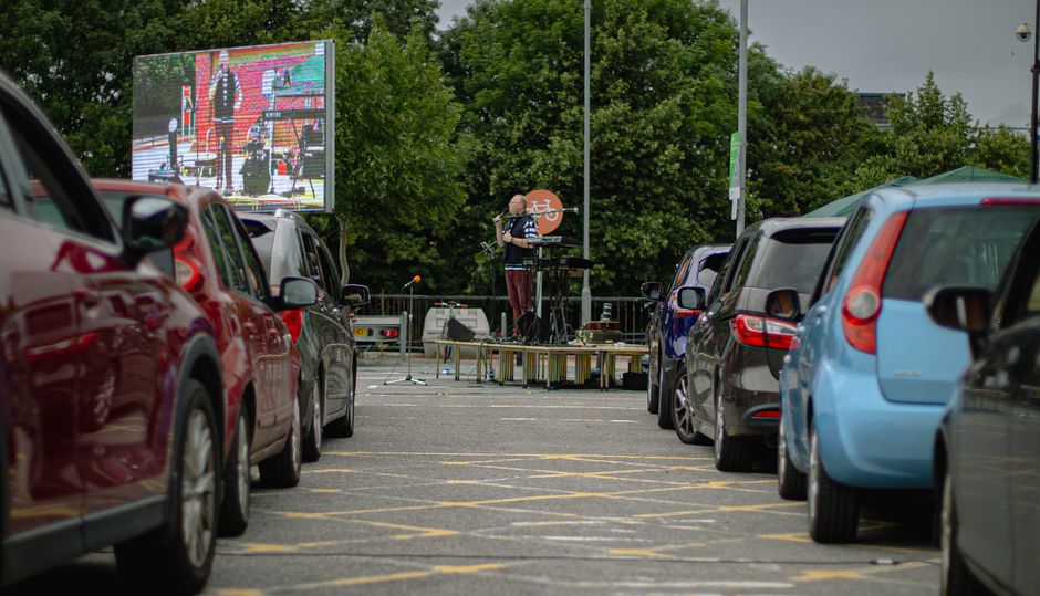 Revd Tom Benyon spoke from a stage at the front of the car park. / <a target="_blank" href="https://twitter.com/StMichaelsSG">@StMichaelsSG</a>,