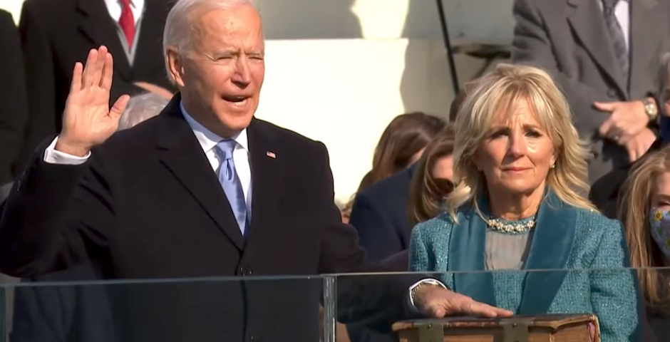 Biden took the oath of office by placing his hand on a large family Bible ./ CNBC,